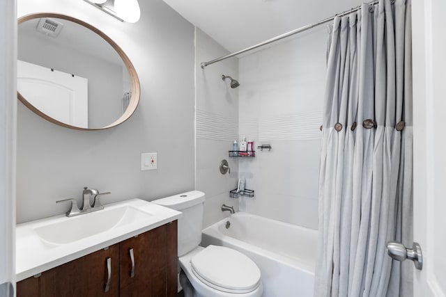 bathroom featuring shower / bath combination with curtain, toilet, visible vents, and vanity