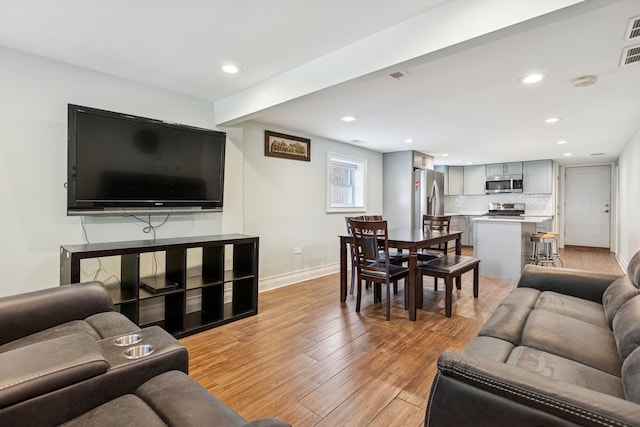4825 W Ainslie St, Chicago, IL 60630 - living area featuring light wood-style flooring and recessed lighting