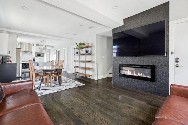 4825 W Ainslie St, Chicago, IL 60630 - living area with wood finished floors, a glass covered fireplace, and recessed lighting