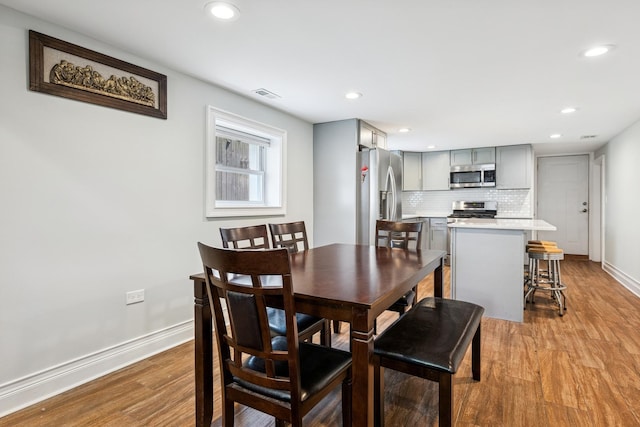 4825 W Ainslie St, Chicago, IL 60630 - dining room featuring light wood-style flooring and recessed lighting