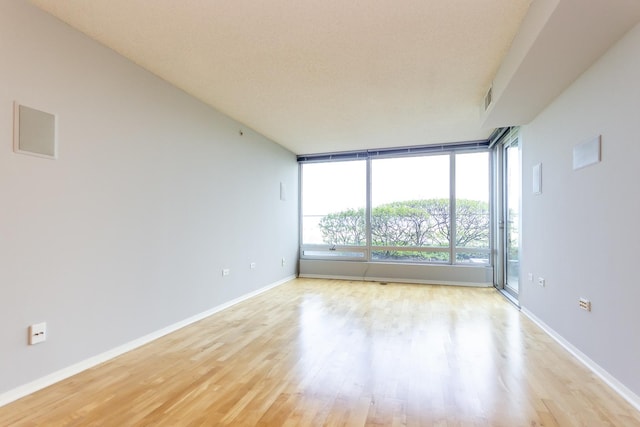 9715 Woods Dr Unit 805, Skokie, IL 60077 - empty room with light wood-style floors and baseboards