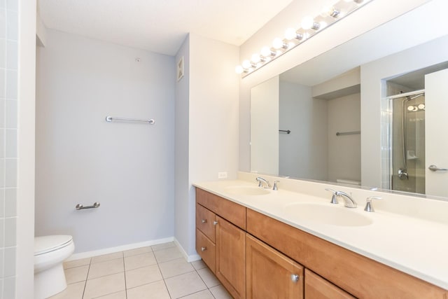 9715 Woods Dr Unit 805, Skokie, IL 60077 - full bathroom with toilet, tile patterned floors, an enclosed shower, double vanity, and baseboards