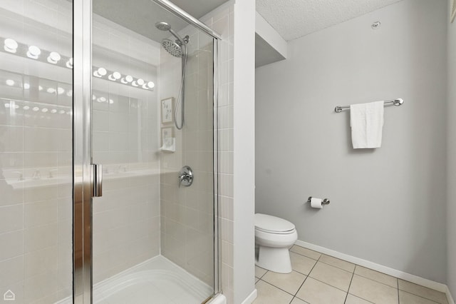 9715 Woods Dr Unit 805, Skokie, IL 60077 - full bathroom featuring tile patterned flooring, a stall shower, and a textured ceiling