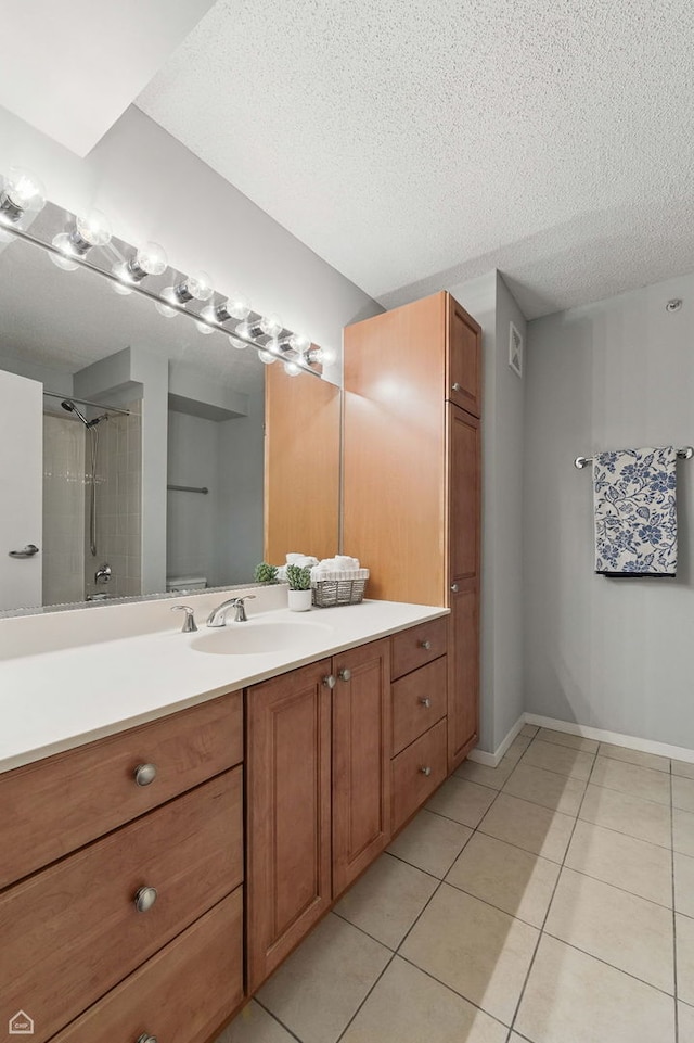 9715 Woods Dr Unit 805, Skokie, IL 60077 - full bathroom featuring tile patterned floors, vanity, a textured ceiling, and a shower