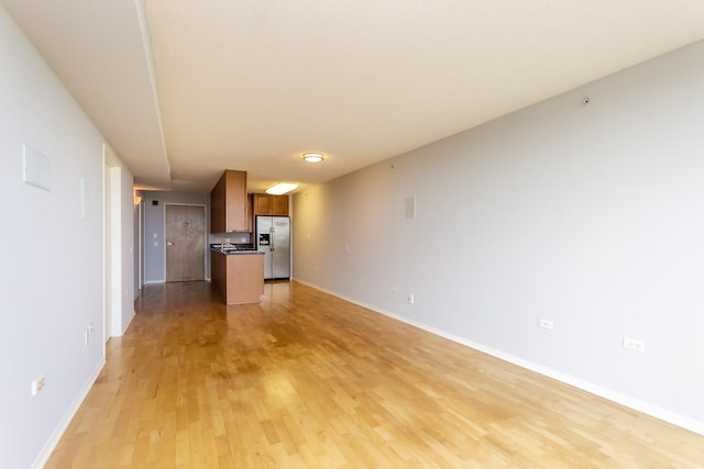 9715 Woods Dr Unit 805, Skokie, IL 60077 - unfurnished living room with light wood finished floors and baseboards