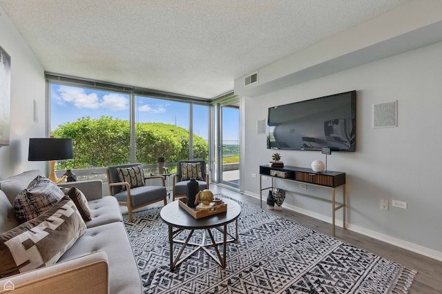9715 Woods Dr Unit 805, Skokie, IL 60077 - living room with a textured ceiling, wood finished floors, and floor to ceiling windows