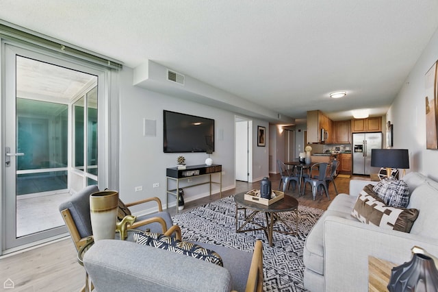 9715 Woods Dr Unit 805, Skokie, IL 60077 - living room with light wood-type flooring and baseboards