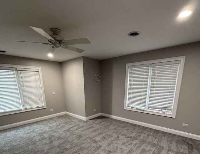 carpeted spare room featuring baseboards, visible vents, recessed lighting, and ceiling fan
