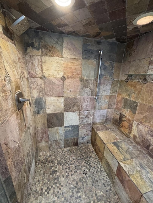 full bath featuring a tile shower
