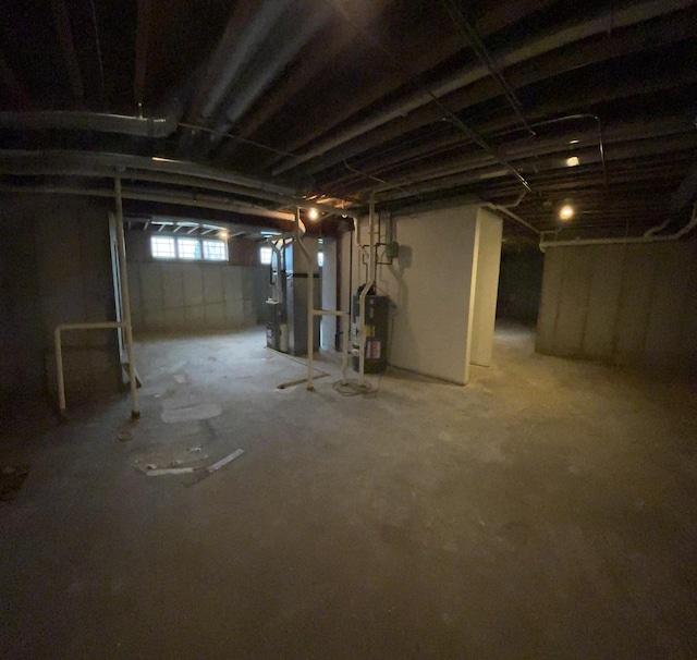 basement with heating unit and water heater