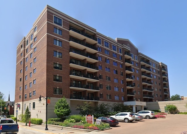 view of property with uncovered parking