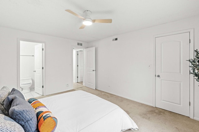 bedroom with visible vents, a ceiling fan, light carpet, connected bathroom, and baseboards