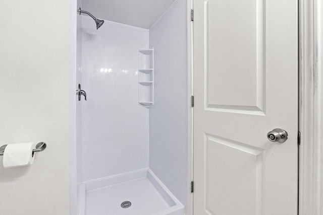 bathroom with a stall shower
