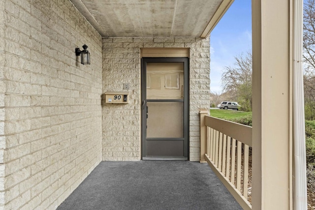 entrance to property featuring a porch
