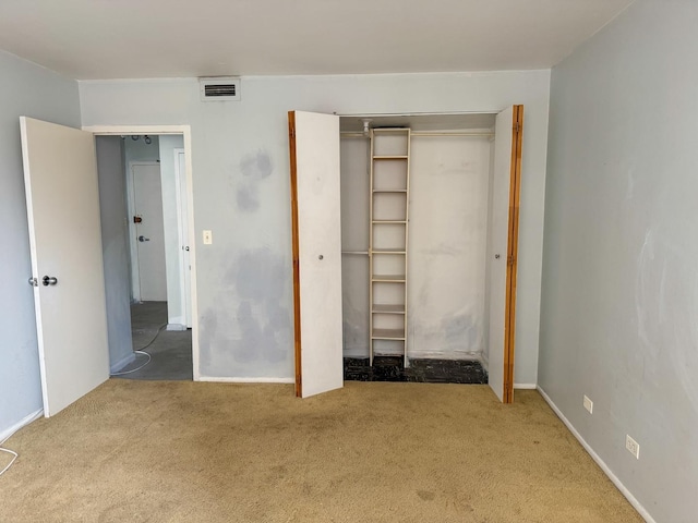 6301 N Sheridan Rd Unit 6D, Chicago, IL 60660 - unfurnished bedroom with baseboards, visible vents, a closet, and carpet