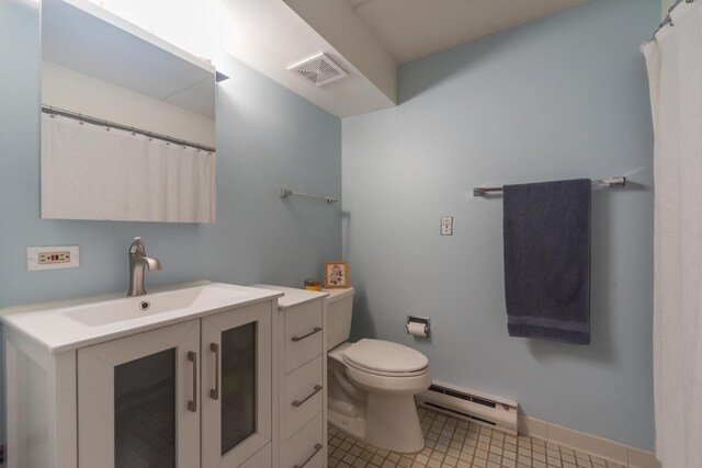 bathroom with visible vents, vanity, toilet, baseboards, and a baseboard radiator