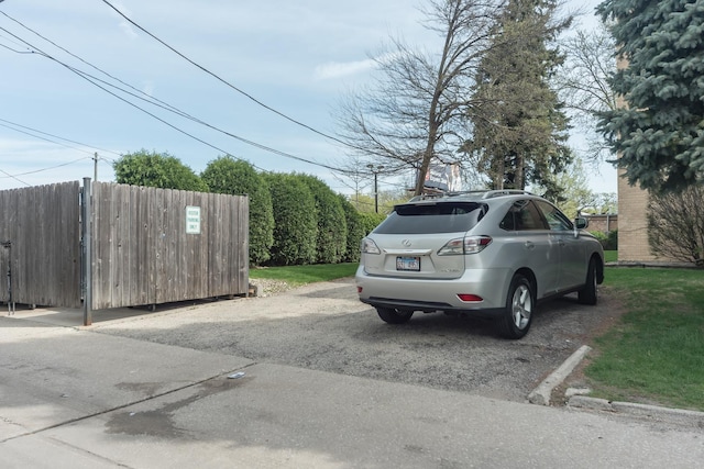 uncovered parking lot with fence