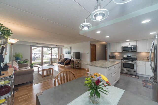 dining room featuring recessed lighting, a toaster, and visible vents