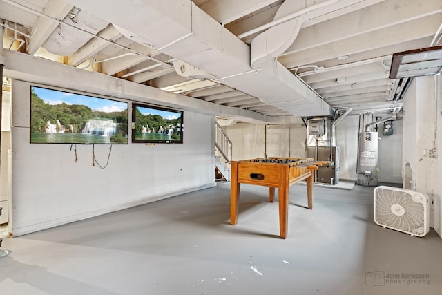 basement featuring stairway and gas water heater
