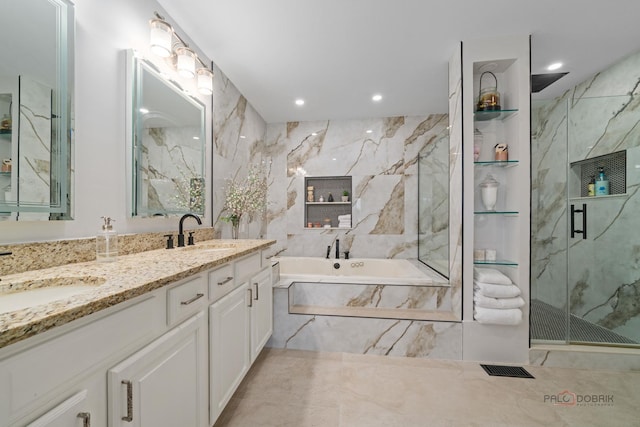 357 Torrey Pines Way, Vernon Hills, IL 60061 - full bath with a marble finish shower, a bath, double vanity, recessed lighting, and tile walls