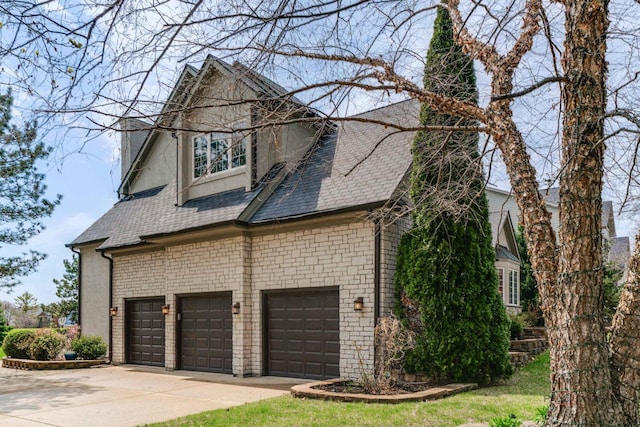 357 Torrey Pines Way, Vernon Hills, IL 60061 - view of side of property featuring an attached garage, driveway, and a shingled roof