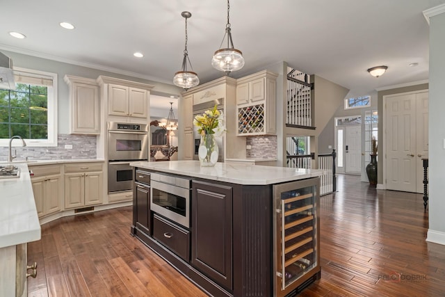 357 Torrey Pines Way, Vernon Hills, IL 60061 - kitchen with wine cooler, cream cabinets, stainless steel appliances, recessed lighting, and decorative backsplash