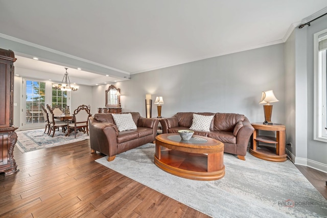 357 Torrey Pines Way, Vernon Hills, IL 60061 - living room featuring wood finished floors, crown molding, a chandelier, baseboards, and recessed lighting