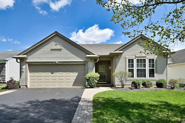 11882 Ludbury, Huntley, IL 60142 - ranch-style house featuring asphalt driveway, an attached garage, and a front yard