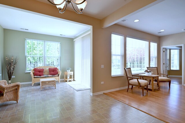 11882 Ludbury, Huntley, IL 60142 - dining area featuring a chandelier, baseboards, healthy amount of natural light, and recessed lighting