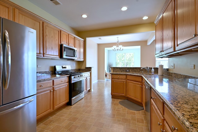11882 Ludbury, Huntley, IL 60142 - kitchen featuring appliances with stainless steel finishes, a sink, a chandelier, recessed lighting, and dark stone counters
