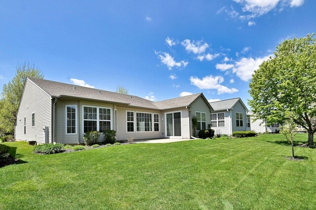 11882 Ludbury, Huntley, IL 60142 - back of house featuring a patio area and a lawn