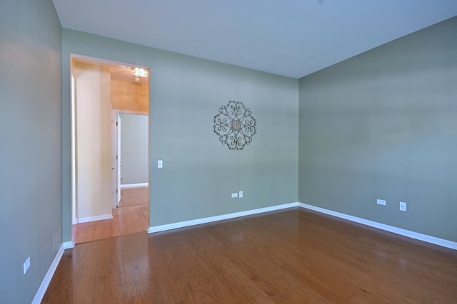 11882 Ludbury, Huntley, IL 60142 - unfurnished room with wood finished floors and baseboards