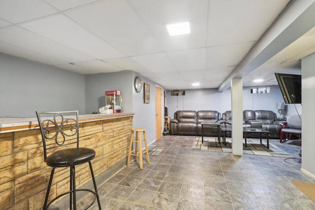 bar featuring a bar and a drop ceiling