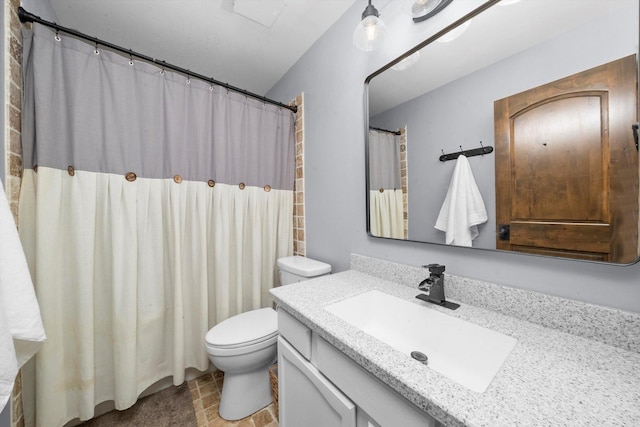 full bathroom featuring vanity and toilet
