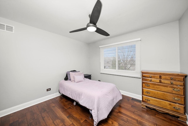 bedroom with visible vents, hardwood / wood-style floors, and baseboards