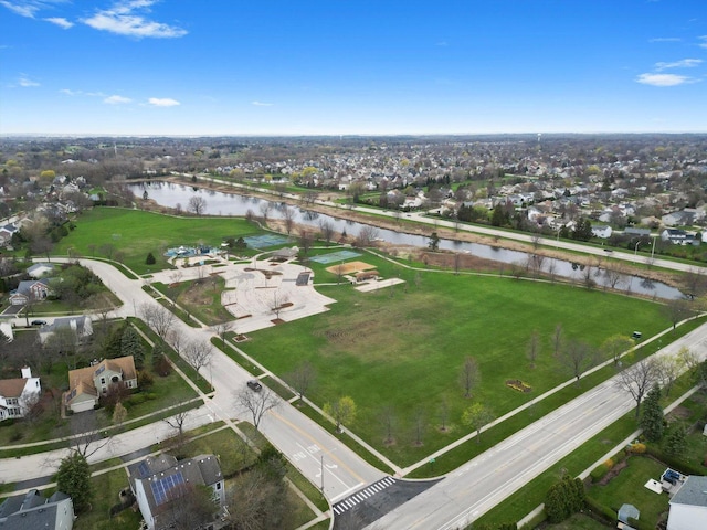drone / aerial view featuring a water view and a residential view