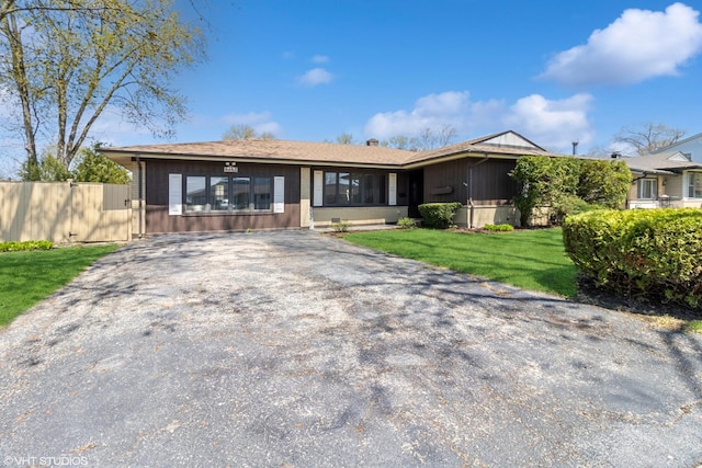 210 Walnut Ln, Elk Grove Village, IL 60007 - ranch-style house with fence, board and batten siding, driveway, and a front lawn