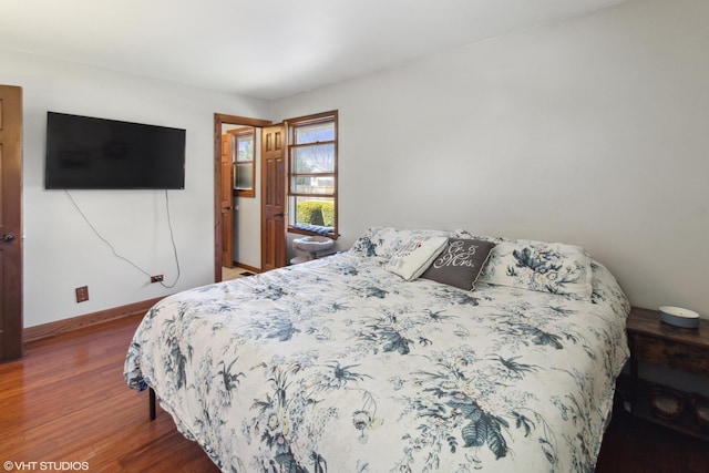 210 Walnut Ln, Elk Grove Village, IL 60007 - bedroom with baseboards and wood finished floors