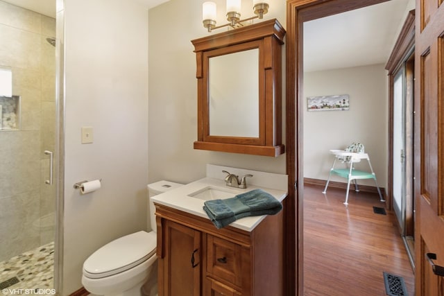 210 Walnut Ln, Elk Grove Village, IL 60007 - full bath with vanity, a shower stall, toilet, and wood finished floors