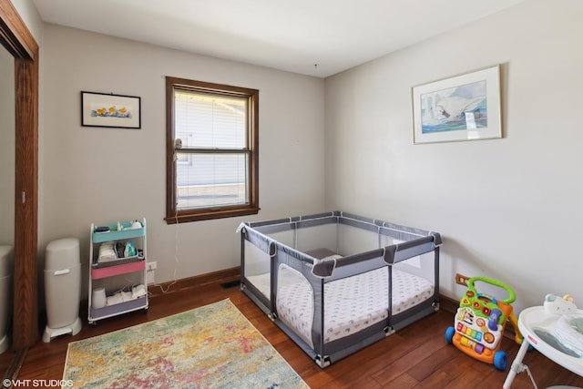 210 Walnut Ln, Elk Grove Village, IL 60007 - bedroom featuring baseboards, wood finished floors, and a closet