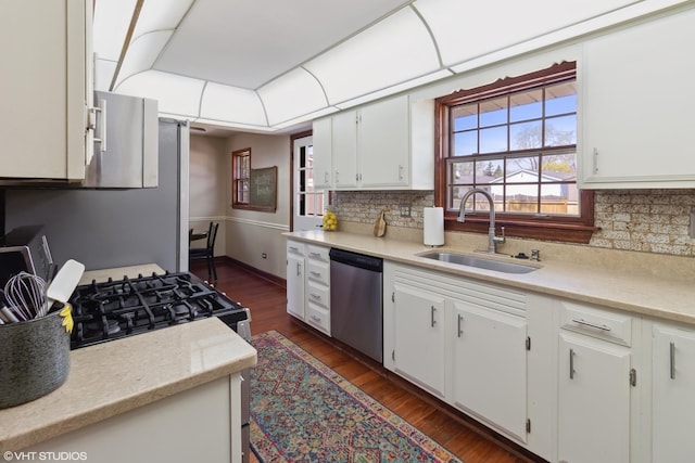 210 Walnut Ln, Elk Grove Village, IL 60007 - kitchen with a sink, light countertops, stainless steel dishwasher, and backsplash