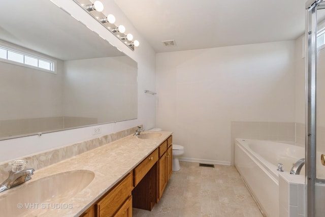 10600 Thornham Ln, Mokena, IL 60448 - bathroom featuring a bath, toilet, double vanity, and baseboards