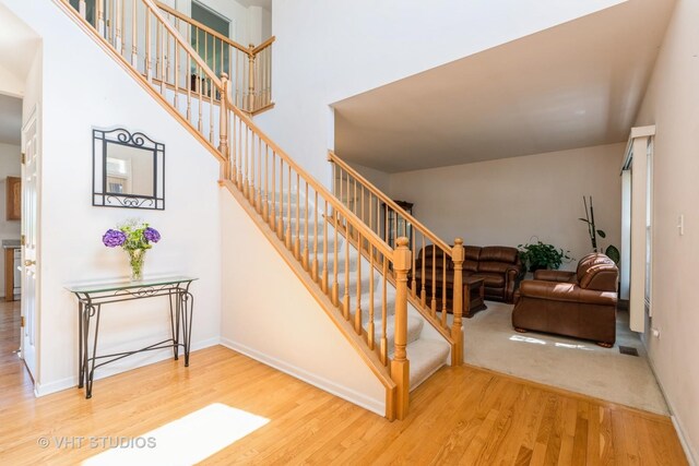 10600 Thornham Ln, Mokena, IL 60448 - staircase with wood finished floors and baseboards