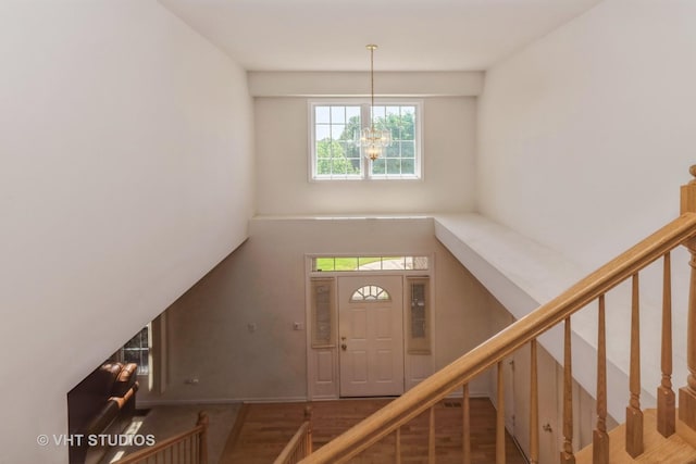 10600 Thornham Ln, Mokena, IL 60448 - entryway with a chandelier, plenty of natural light, stairway, and wood finished floors