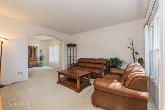 10600 Thornham Ln, Mokena, IL 60448 - carpeted living area featuring arched walkways and baseboards