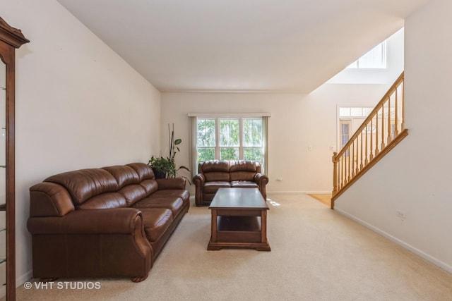 10600 Thornham Ln, Mokena, IL 60448 - living area with stairs, baseboards, and light carpet