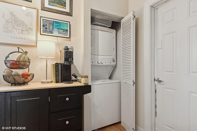536.5 W Belmont Ave Unit 3N, Chicago, IL 60657 - washroom with light wood finished floors, stacked washer / dryer, and laundry area