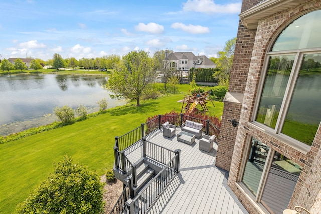 deck featuring a water view, an outdoor hangout area, and a yard