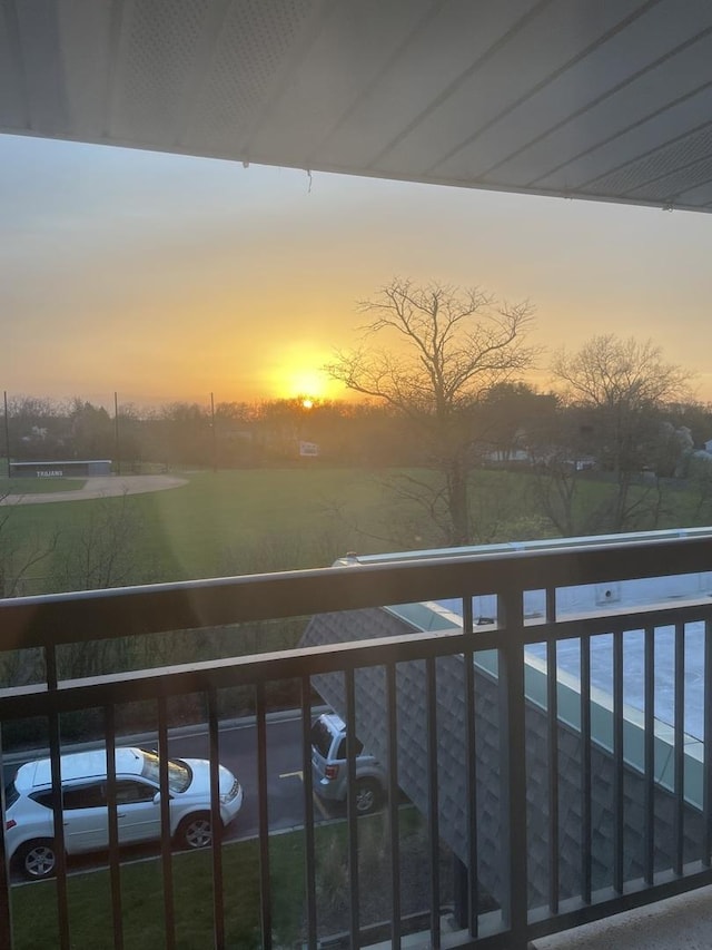 view of balcony at dusk