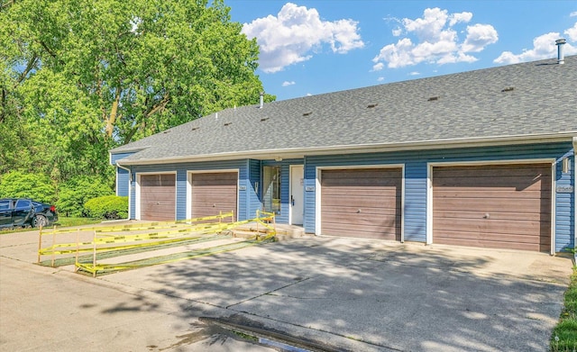 2567 Clayton Blvd Unit 2567, Champaign, IL 61822 - ranch-style house featuring driveway, roof with shingles, and an attached garage